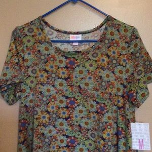 New with tags Lularoe Carly Dress, size Medium. Florals in blue, yellow